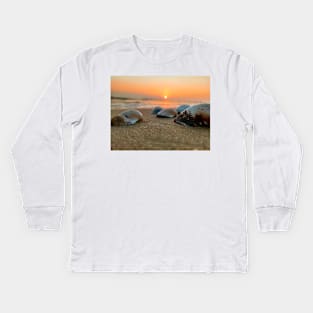 Seashell in the sand with the shining of the Kids Long Sleeve T-Shirt